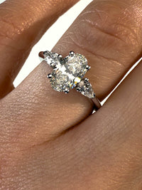 1.30 Carat Oval With Pear Shape Side Stones Diamond Engagement Ring In 14k White Gold
