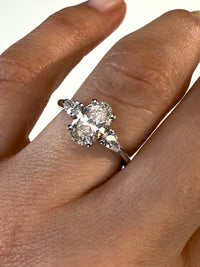 1.30 Carat Oval With Pear Shape Side Stones Diamond Engagement Ring In 14k White Gold