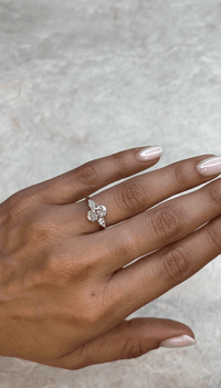 1.40 Carat Oval With Pear-Shaped Side Stones Diamond Engagement Ring